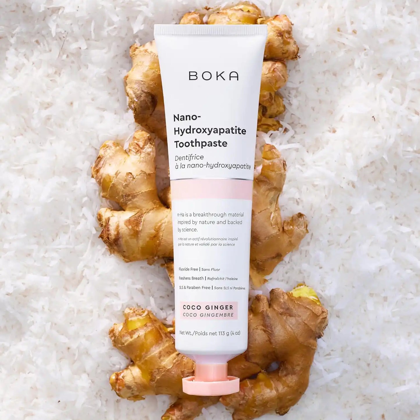 Boka Nano-Hydroxyapatite Toothpaste tube on a bed of ginger root