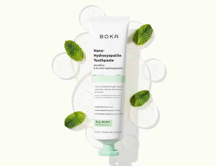 Boka Nano-Hydroxyapatite Toothpaste with mint leaves on a white background