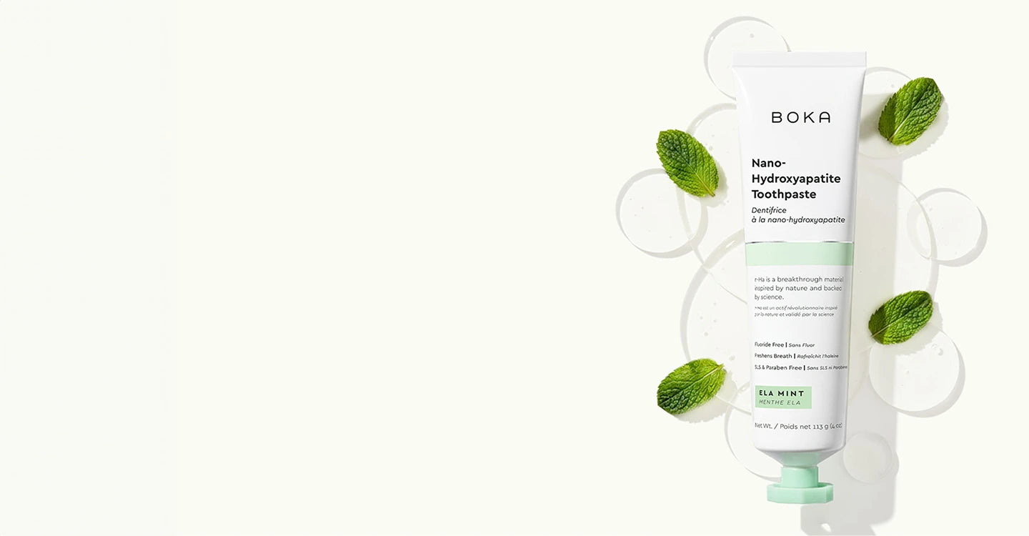 Boka toothpaste tube with green leaves on a white background