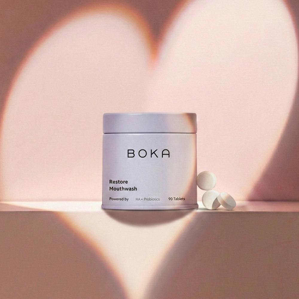 Boka Restore Mouthwash container with tablets on a pink background
